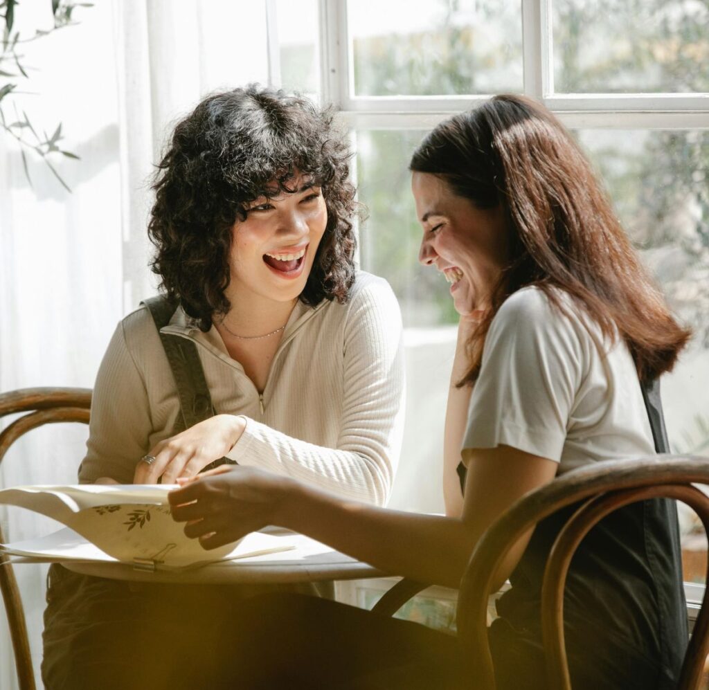 Two women reviewing dental information during consultation in Allen TX office