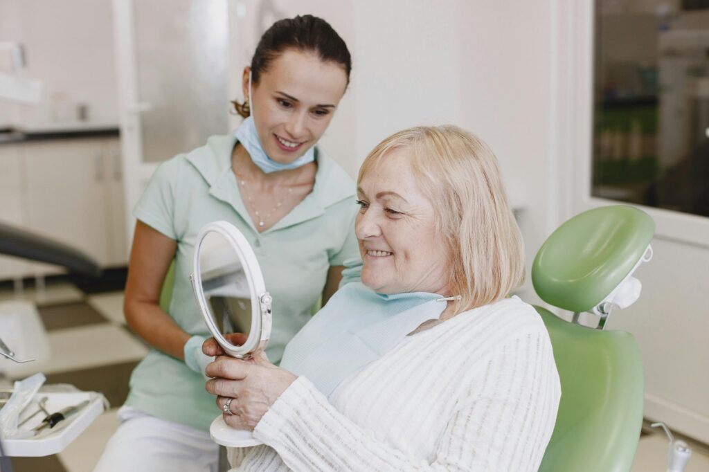 Senior patient smiling during dental visit in Allen TX office