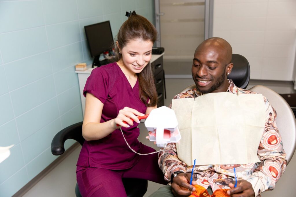 Dentist explaining treatment plan to patient in Allen TX clinic