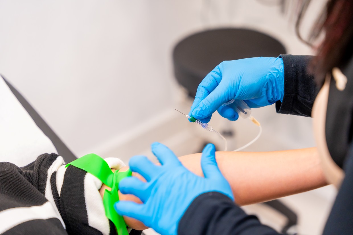 expertise extracting blood in a modern beauty clinic